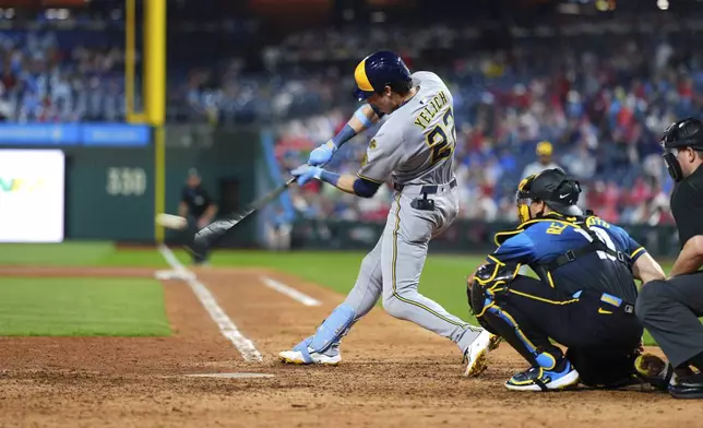 Milwaukee Brewers' Christian Yelich hits a home run against Philadelphia Phillies pitcher Carlos Hernández during the ninth inning of a baseball game Friday, May 30, 2025, in Philadelphia. (AP Photo/Matt Slocum)