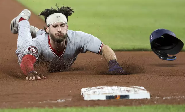Washington Nationals' Dylan Crews advances to third base during the seventh inning of a baseball game against the Baltimore Orioles, Friday, May 16, 2025, in Baltimore (AP Photo/Daniel Kucin Jr.)