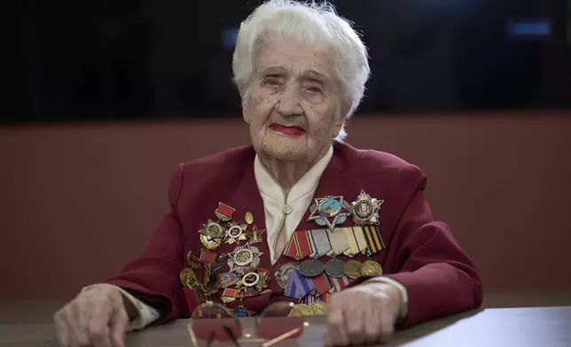 World War II veteran Maria Rokhlina, 100, poses for a portrait in Moscow, Russia, on Monday, April 28, 2025. Rokhlina volunteered to build defensive lines near the Ukrainian capital of Kyiv and later became a combat medic. (AP Photo/Alexander Zemlianichenko)