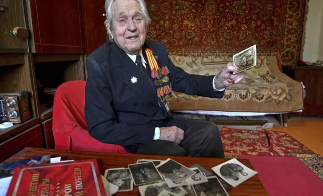 World War II veteran Mikhail Sukhinin, 97, poses for a portrait in Bishkek, Kyrgyzstan, on Thursday, April 10, 2025. Sukhinin was drafted into the Soviet army in 1944 and served in a rifle regiment. (AP Photo/Vladimir Voronin)