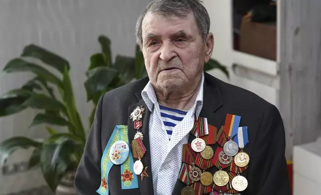 World War II veteran Vasily Zinchenko, 101, poses for a portrait in Almaty, Kazakhstan, on Wednesday, April 16, 2025. Zinchenko took part in key battles, including the Battle of Stalingrad. (AP Photo/Vladimir Tretyakov)