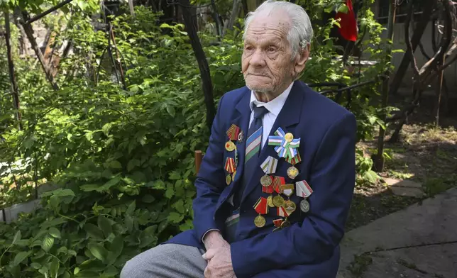 World War II veteran Fyodor Fedin poses for a portrait in Tashkent, Uzbekistan, on Wednesday, April 23, 2025. Fedin joined the Soviet army in 1944 and was a communications operator in an air defense unit. (AP Photo/Anvar Ilyasov)
