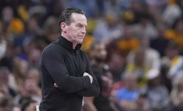 Cleveland Cavaliers head coach Kenny Atkinson watches from the bench in the first half of Game 4 against the Indiana Pacers in the Eastern Conference semifinals of the NBA basketball playoffs in Indianapolis, Sunday, May 11, 2025. (AP Photo/Michael Conroy)
