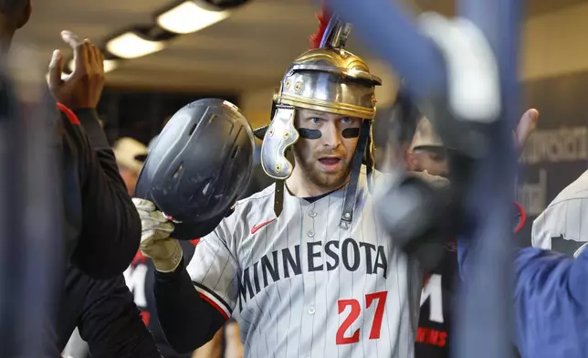 Minnesota Twins' Ryan Jeffers reacts after his home run against the Milwaukee Brewers during the first inning of a baseball game, Saturday May 17, 2025, in Milwaukee. (AP Photo/Jeffrey Phelps)
