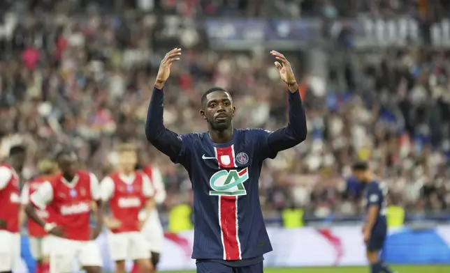 PSG's Ousmane Dembele celebrate at the end of the French Cup soccer final between Paris Saint-Germain and Reims at the Stade de France stadium in Saint-Denis, outside Paris, Saturday, May 24, 2025. (AP Photo/Aurelien Morissard)