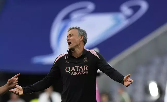 PSG's head coach Luis Enrique gestures during a training session ahead of the Champions League final soccer match between Paris Saint-Germain and Inter Milan in Munich, Germany, Friday, May 30, 2025. (AP Photo/Luca Bruno)