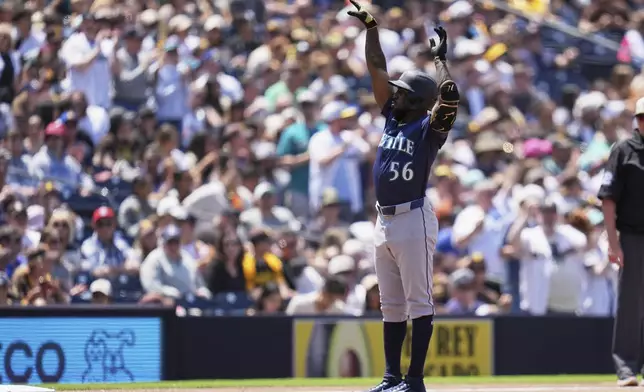 Seattle Mariners' Randy Arozarena (56) celebrates after hitting a home run during the fourth inning of a baseball game against the San Diego Padres Sunday, May 18, 2025, in San Diego. (AP Photo/Gregory Bull)