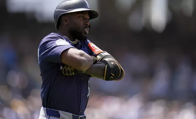 Seattle Mariners' Randy Arozarena celebrates after hitting a home run during the fourth inning of a baseball game against the San Diego Padres Sunday, May 18, 2025, in San Diego. (AP Photo/Gregory Bull)