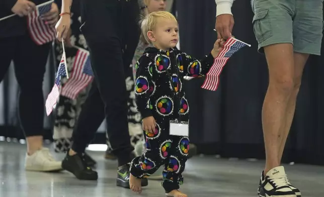 Afrikaner refugees from South Africa arrive, Monday, May 12, 2025, at Dulles International Airport in Dulles, Va. (AP Photo/Julia Demaree Nikhinson)