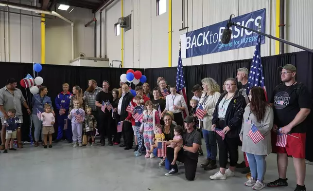 Afrikaner refugees from South Africa arrive, Monday, May 12, 2025, at Dulles International Airport in Dulles, Va. (AP Photo/Julia Demaree Nikhinson)