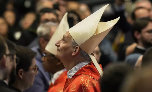 Cardinal Matteo Maria Zuppi looks up during a final Mass celebrated by cardinals inside St. Peter's Basilica, before the conclave to elect a new pope, at the Vatican, Wednesday, May 7, 2025. (AP Photo/Gregorio Borgia)