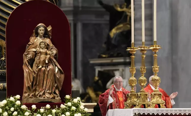 Cardinal Pietro Parolin, left, celebrates a final Mass celebrated by cardinals inside St. Peter's Basilica, before the conclave to elect a new pope, at the Vatican, Wednesday, May 7, 2025. (AP Photo/Gregorio Borgia)