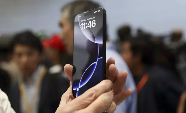 FILE - The new iPhone 16 is displayed during an announcement of new products at Apple headquarters Monday, Sept. 9, 2024, in Cupertino, Calif. (AP Photo/Juliana Yamada, File)