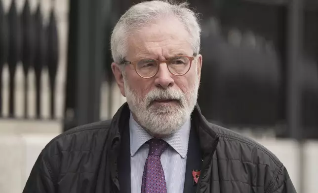 Former Sinn Fein president Gerry Adams walks outside the High Court where he is bringing a legal action against the BBC over allegations about the murder of an MI5 spy in 2006,in Dublin, Ireland, Wednesday May 28, 2025. (Brian Lawless/PA via AP)