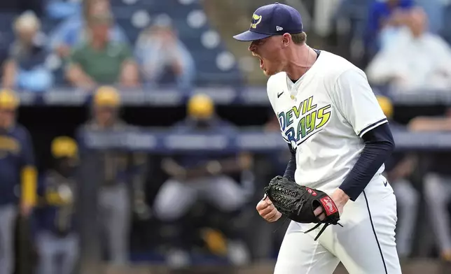 Tampa Bay Rays pitcher Pete Fairbanks reacts after getting out a jam against the Milwaukee Brewers during the ninth inning of a baseball game Saturday, May 10, 2025, in Tampa, Fla. (AP Photo/Chris O'Meara)