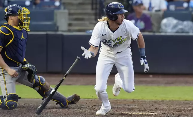 Tampa Bay Rays' Travis Jankowski, right, watches his RBI single off Milwaukee Brewers pitcher Trevor Megill during the ninth inning of a baseball game Saturday, May 10, 2025, in Tampa, Fla. (AP Photo/Chris O'Meara)
