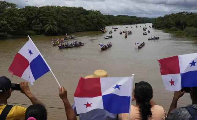 Demonstrators protest a planned reservoir for the Panama Canal at the mouth of the Indio River on Panama's Caribbean coast, Friday, May 16, 2025. (AP Photo/Matias Delacroix)