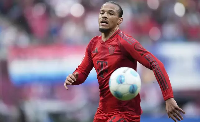 Bayern's Leroy Sane controls the ball during the German Bundesliga soccer match between RB Leipzig and FC Bayern Munich at the Red Bull Arena in Leipzig, Germany, Saturday, May 3, 2025. (AP Photo/Ebrahim Noroozi)