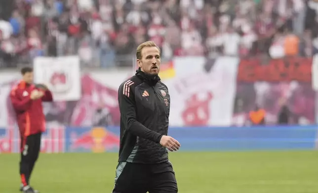 Bayern's Harry Kane walks on the pitch at the end of the German Bundesliga soccer match between RB Leipzig and FC Bayern Munich at the Red Bull Arena in Leipzig, Germany, Saturday, May 3, 2025. (AP Photo/Matthias Schrader)
