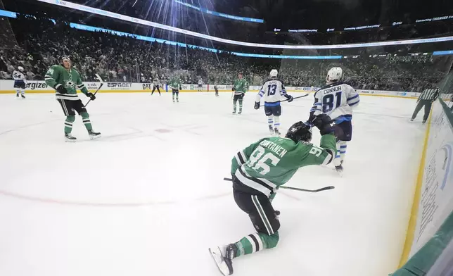 Dallas Stars' Mikko Rantanen (96) celebrates his goal in the third period of Game 3 of a second-round NHL hockey playoff series against the Winnipeg Jets in Dallas, Sunday, May 11, 2025. (AP Photo/Julio Cortez)