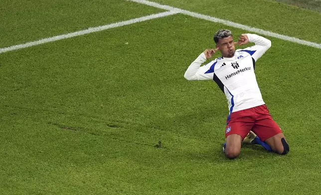Hamburg's Ransford Königsdörffer celebrates his goal during a Bundesliga 2 soccer game between Hamburger SV and SSV Ulm 1846 in Hamburg, Germany, Saturday, May 10, 2025. (Marcus Brandt/dpa via AP)