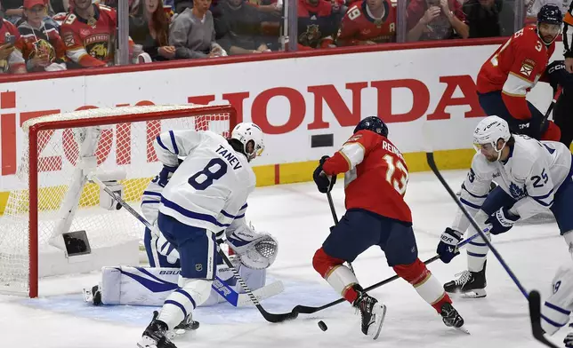 Florida Panthers center Sam Reinhart (13) tries to score against the Toronto Maple Leafs during the first period of Game 4 of a second-round NHL hockey playoff series, Sunday, May 11, 2025, in Sunrise, Fla. (AP Photo/Michael Laughlin)