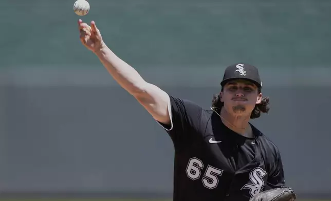 Chicago White Sox starting pitcher Davis Martin throws during the first inning of a baseball game against the Kansas City Royals, Thursday, May 8, 2025, in Kansas City, Mo. (AP Photo/Charlie Riedel)