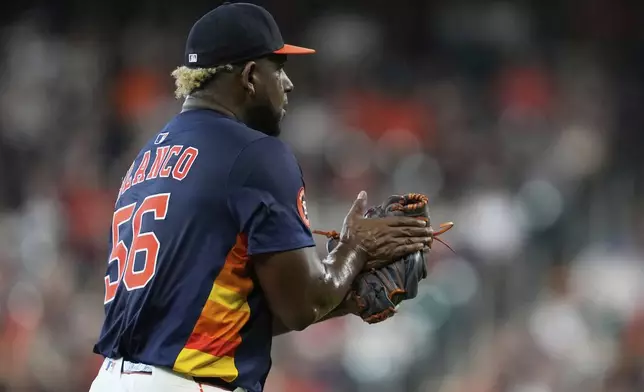 Houston Astros starting pitcher Ronel Blanco throws celebreats after the top of the first inning of a baseball game against the Cincinnati Reds in Houston, Sunday, May 11, 2025. (AP Photo/Ashley Landis)