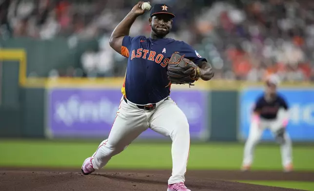 Houston Astros starting pitcher Ronel Blanco throws during the first inning of a baseball game against the Cincinnati Reds in Houston, Sunday, May 11, 2025. (AP Photo/Ashley Landis)