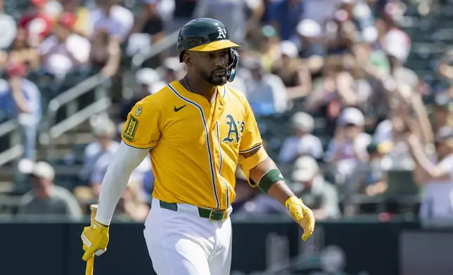 Athletics' Miguel Andujar leaves the field after being ejected by umpire Roberto Ortiz during the seventh inning of a baseball game against the Philadelphia Phillies, Sunday, May 25, 2025, in West Sacramento, Calif. (AP Photo/Sara Nevis)