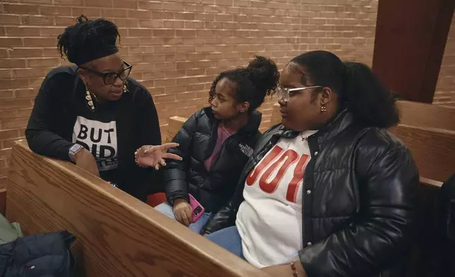 Activist Dana M. Murray, left, speaks to students during a Town Hall and a voter registration for school board elections at the Bethany Baptist Church, Saturday, Feb. 1, 2025, in Newark, N.J. (AP Photo/Andres Kudacki)