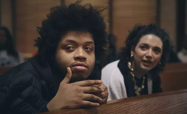 Youth listen to a speaker during a Town Hall and voter registration for school board elections at the Bethany Baptist Church, Saturday, Feb. 1, 2025, in Newark, N.J. (AP Photo/Andres Kudacki)