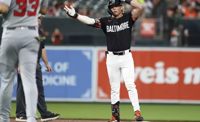 Baltimore Orioles' Jackson Holliday celebrates after hitting a double during the second inning of a baseball game against the Washington Nationals, Friday, May 16, 2025, in Baltimore (AP Photo/Daniel Kucin Jr.)