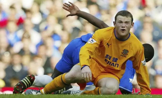FILE - Everton's Wayne Rooney looks on during their English Premier League soccer match at Chelsea's Stamford Bridge ground in west London, Saturday April 17, 2004. (AP Photo/Alastair Grant, File)