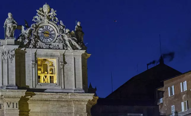 Black smoke billows from the chimney of the Sistine Chapel, where 133 cardinals are gathering on the first day of the conclave, indicating that a successor of late Pope Francis was not elected, Wednesday, May 7, 2025. (AP Photo/Bernat Armangue)