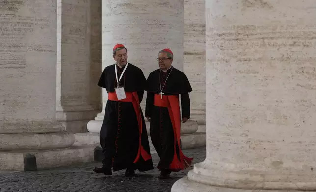 Cardinals Ruben Salazar Gomez, left is flanked by Cardinal Luis José Rueda Aparicio as they arrive in the New Hall of the Synod at the Vatican, Tuesday, May 6, 2025, the last time before the start of the conclave starting in the afternoon of Wenesday, May 7, when they will elect the successor of Pope Francis. (AP Photo/Gregorio Borgia)