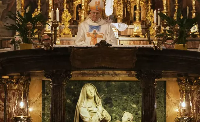 Cardinal Peter Erdo leads a mass at his titular church of Santa Francesca Romana in Rome, Sunday, May 4, 2025. (AP Photo/Francisco Seco)