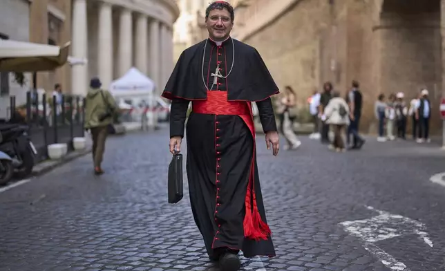 Cardinal Francis Leo walks near the Vatican, Tuesday, May 6, 2025. (AP Photo/Bernat Armangue)