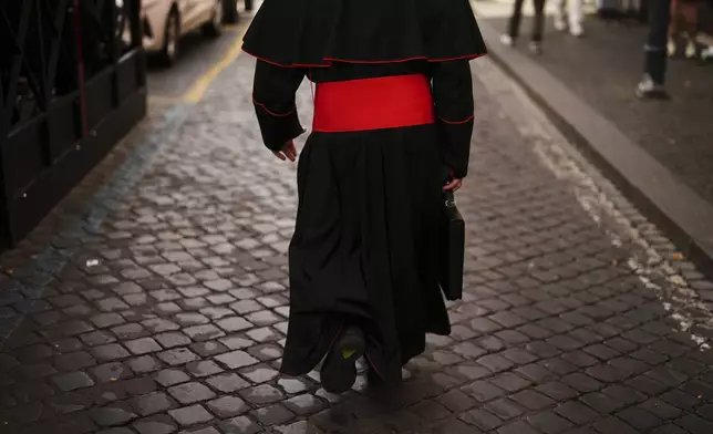 Cardinal John Dew leaves the Vatican on Monday, May 5, 2025, after attending the General Congregation of cardinals in the New Synod Hall where they are preparing for the upcoming conclave starting on May 7, to elect the 267th Roman pontiff. (AP Photo/Francisco Seco)