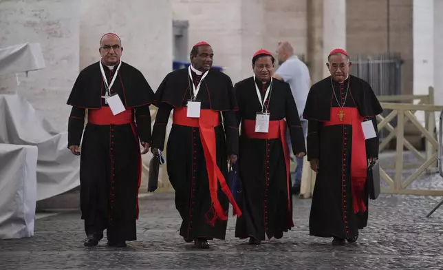 From left, cardinals Fernando Natalio Chomalí Garib, Anthony Poola, Charles Maung Bo and Francis Xavier Kriengsak Kovithavanij leave the Vatican, Saturday, May 3, 2025, after attending a session of the General Congregation of cardinals in the New Synod Hall where they are preparing for the upcoming conclave starting on May 7, to elect the 267th Roman pontiff. (AP Photo/Andrew Medichini)