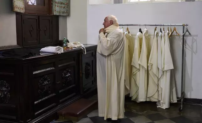 Cardinal Jean-Marc Aveline prepares in the sacristy of Santa Maria ai Monti church before celebrating Mass in Rome, Sunday, May 4, 2025. (AP Photo/Bernat Armangue)