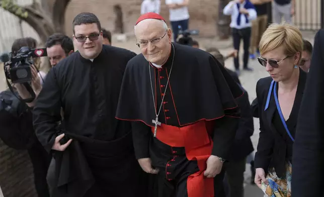 Cardinal Peter Erdo arrives to lead a mass at his titular church of Santa Francesca Romana in Rome, Sunday, May 4, 2025. (AP Photo/Francisco Seco)