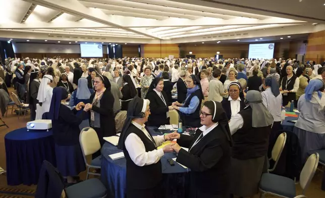 Nuns pray during a congress of nearly 900 superiors of the world's female religious orders in Rome, Monday, May 5, 2025. (AP Photo/Alessandra Tarantino)