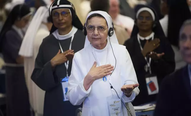 Nuns pray during a congress of nearly 900 superiors of the world's female religious orders in Rome, Monday, May 5, 2025. (AP Photo/Alessandra Tarantino)