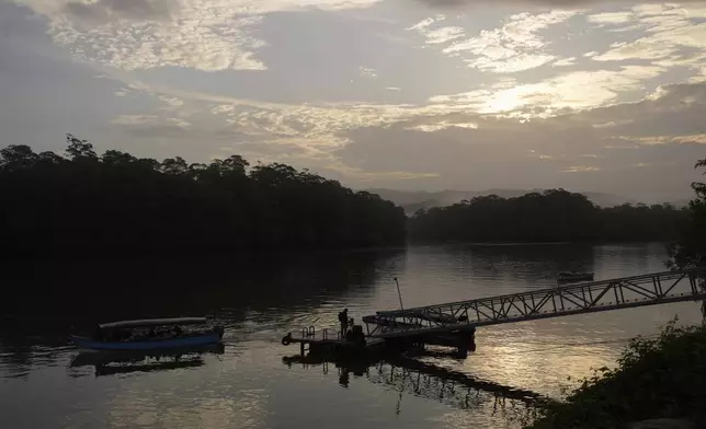 A boat arrives to Puerto Kimba, Panama, Saturday, April 5, 2025. (AP Photo/Matias Delacroix)