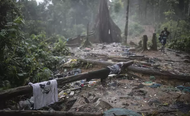 FILE - Clothing and garbage litter the trail where migrants have been trekking across the Darien Gap from Colombia to Panama in hopes of eventually reaching the United States, on May 10, 2023. (AP Photo/Ivan Valencia, File)