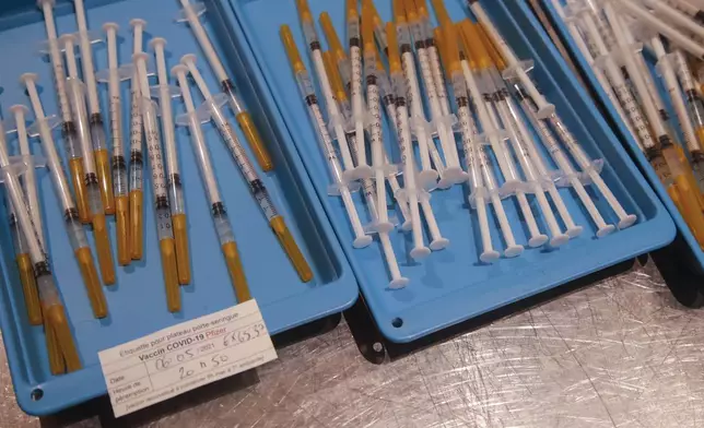 FILE - Syringes with the Pfizer vaccine against COVID-19 disease are ready at a new vaccination center in Paris, Thursday, May 6, 2021. (AP Photo/Michel Euler, File)