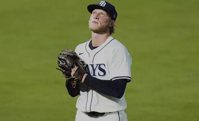 Tampa Bay Rays pitcher Shane Baz reacts after being taken out of the game against the Philadelphia Phillies during the fourth inning of a baseball game Wednesday, May 7, 2025, in Tampa, Fla. (AP Photo/Chris O'Meara)