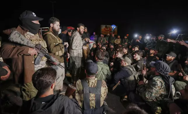 Syria's security forces gather, after reaching a deal with Druze gunmen to deploy around Jaramana, a Damascus suburb that saw fighting earlier this week, in Damascus, Syria, early Friday, May 2, 2025. (AP Photo/Omar Sanadiki)
