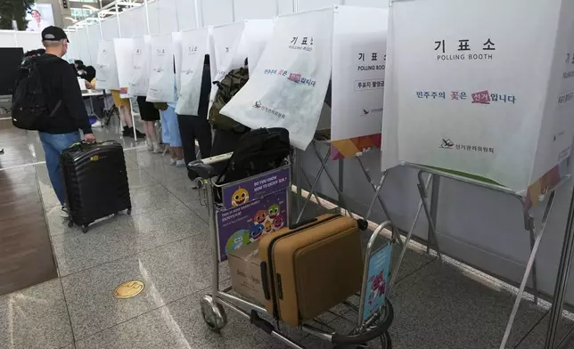 Voters cast their early votes for the June 3 presidential election at a polling station at the departure hall of Incheon International Airport in Incheon, South Korea, Thursday, May 29, 2025. (AP Photo/Lee Jin-man)